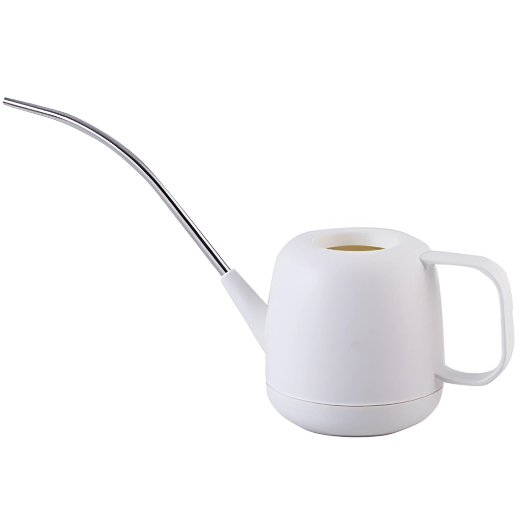 Modern and functional April Showers garden watering can with a sleek metal design, placed on a kitchen counter among various kitchenware items.