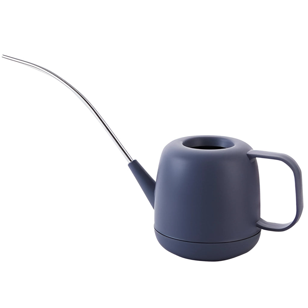Modern and functional April Showers garden watering can in electric blue color placed on a surface.