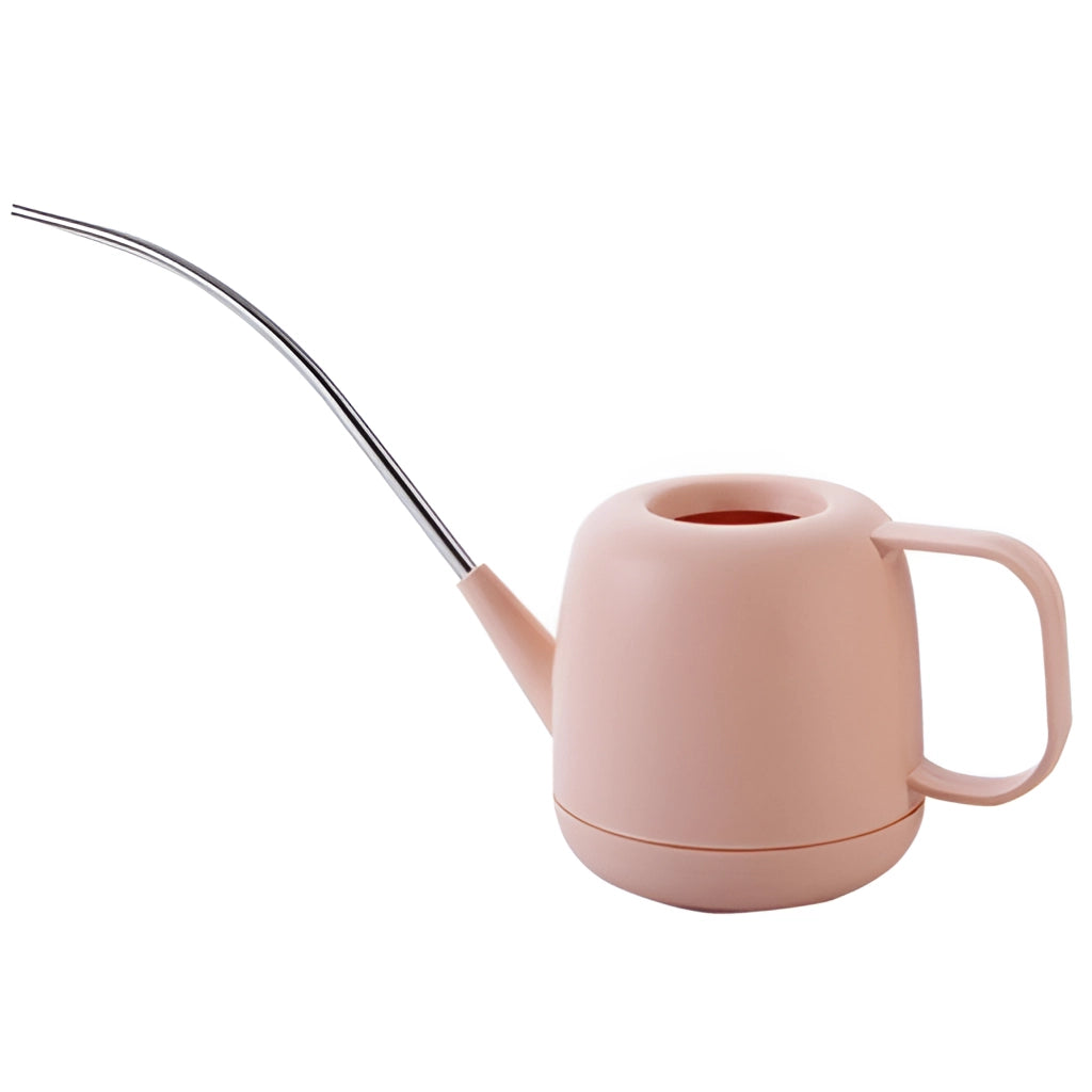 A modern and functional magenta garden watering can placed on a table.