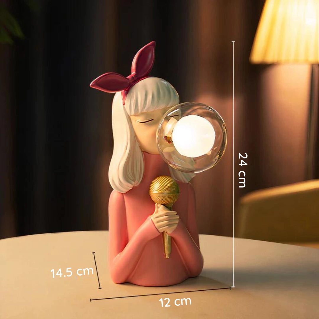Artisan Sisters Handcrafted Wooden Table Lamp in Hazle finish featuring a unique wooden base with a cartoonish design, incorporating elements of plants and animated characters.