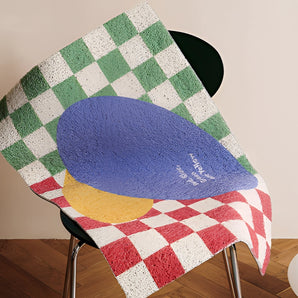 A geometric entrance doormat inspired by Back to the Future, featuring a red, blue, and gray pattern with a rectangular shape.