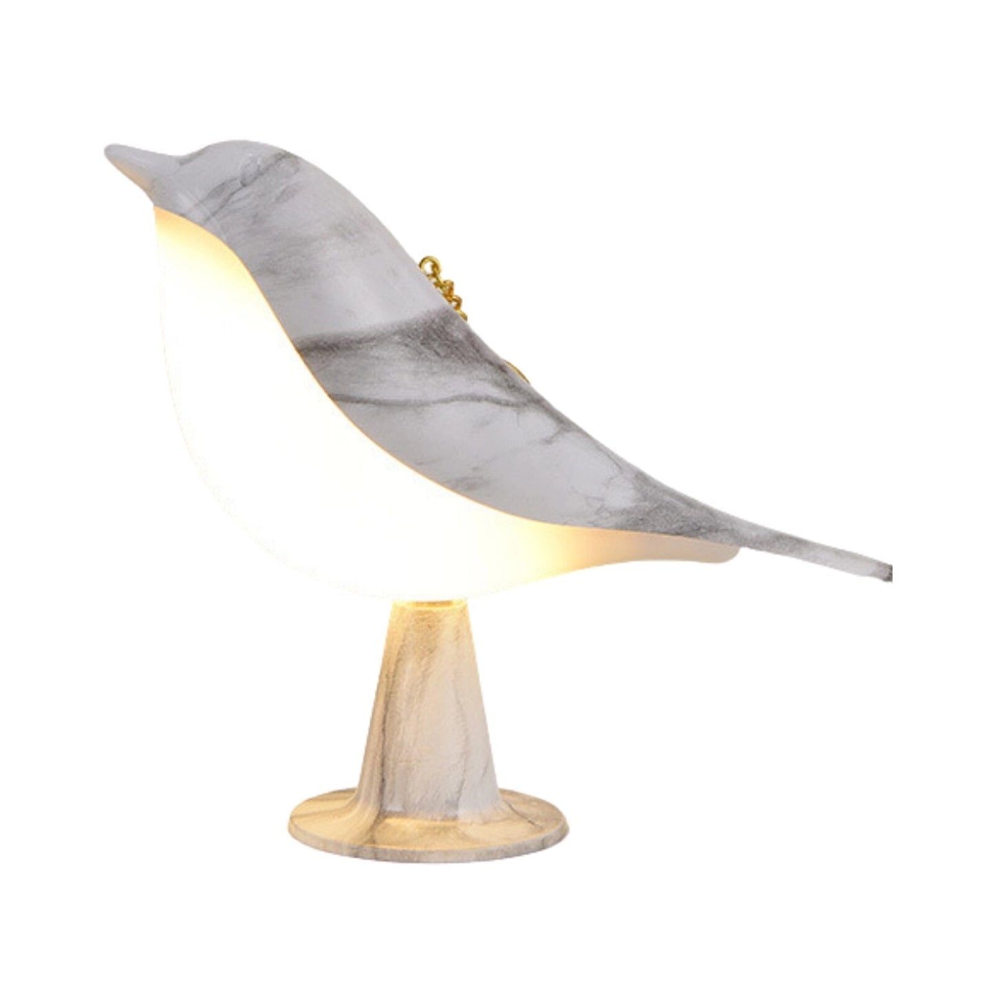A dimmable LED cordless table nightstand light with a bird design, featuring a marble base, placed on a wooden table next to a chair.