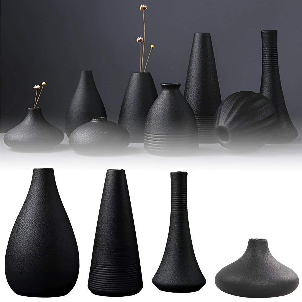 Black ceramic vase with a sleek, modern design ideal for home and garden decor, displayed on a surface.