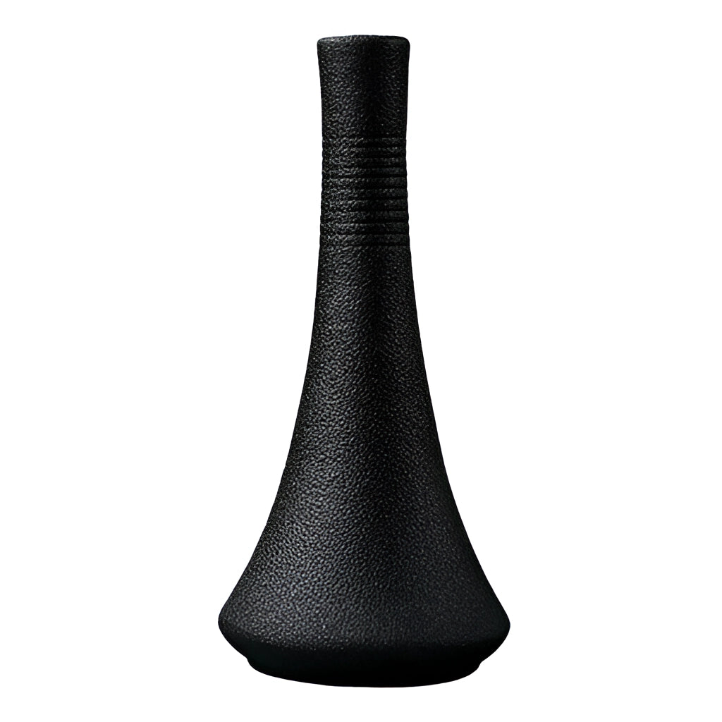 A black ceramic vase with a sleek, modern design featuring artistic patterns, displayed against a plain background.
