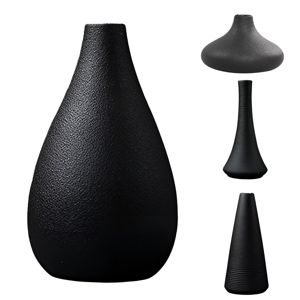 Black ceramic vase displayed in monochrome still life photography with tree illustration in the background.