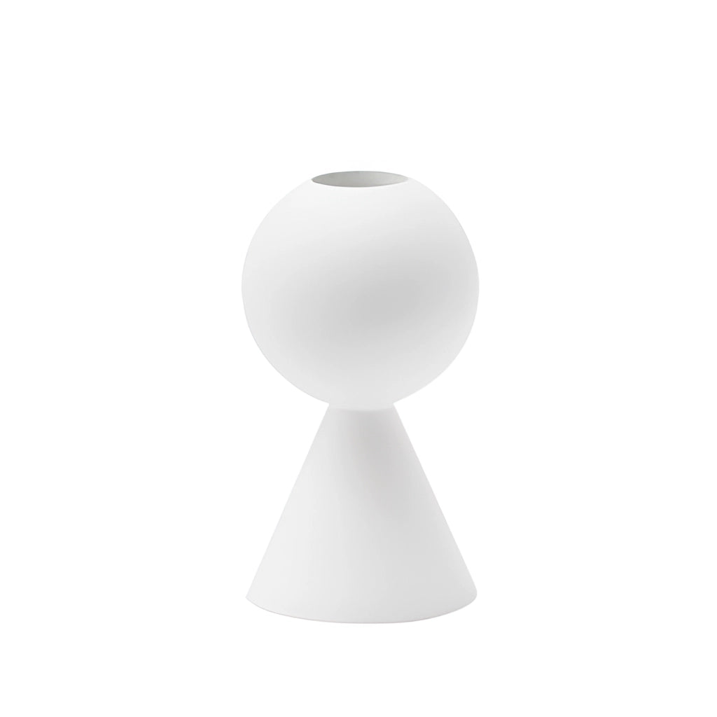 Set of black wooden candle holders on a table, featuring a 10cm white variant, surrounded by home decor elements like plants and lamps.