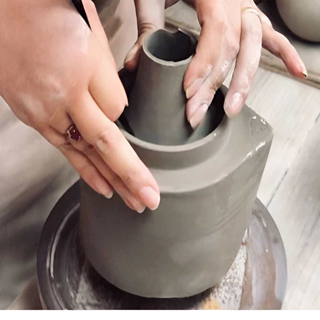 Bright porcelain stackable flowerpot planters made of clay, showcasing creative pottery design with a glossy finish.