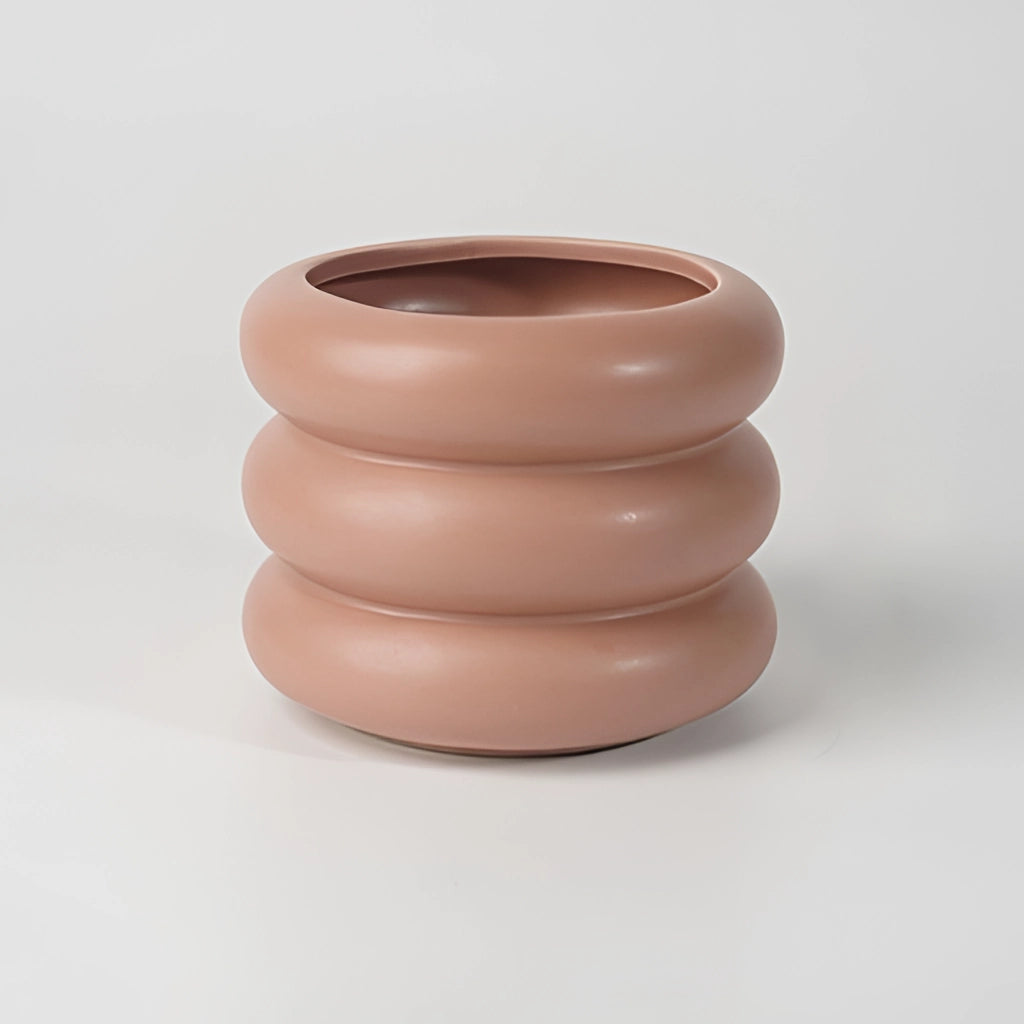 Ceramic round bubble glass planter vase with a smooth, earthenware finish and circular design.