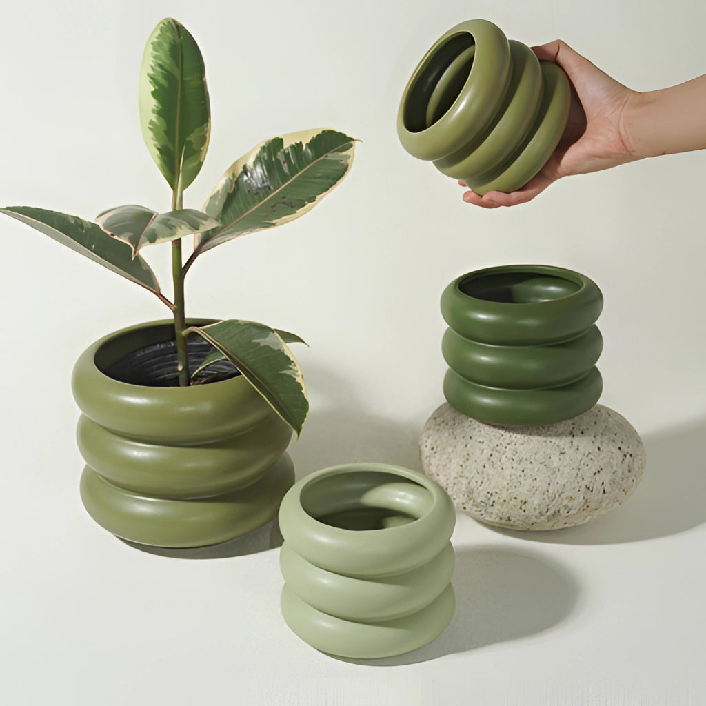 Ceramic round bubble glass planter vase with a houseplant.