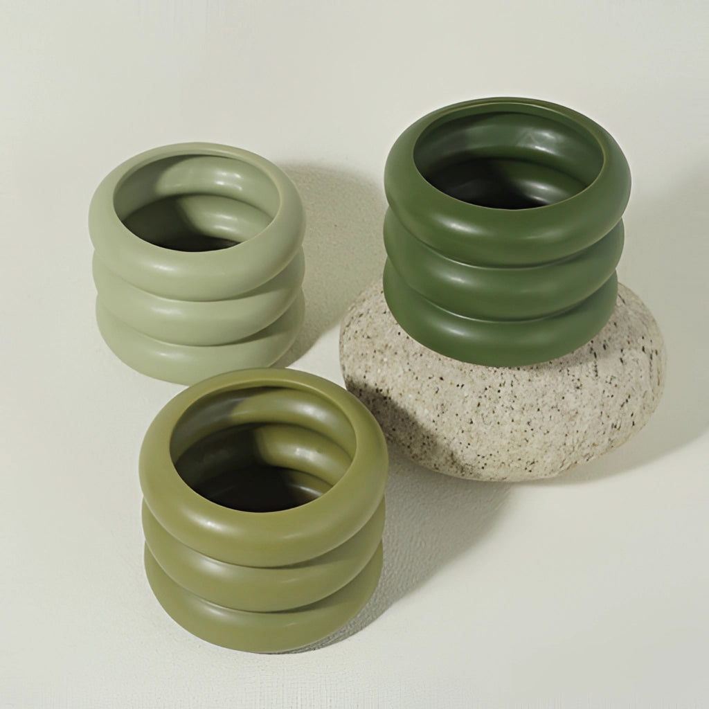 A round ceramic planter vase with a unique bubble glass design.