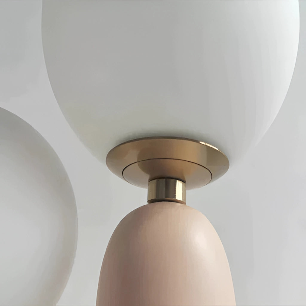 Cactus design table lamp with milk glass globes and LED innovation featuring a beige metal base, circular light fixtures, and artistic tints and shades.