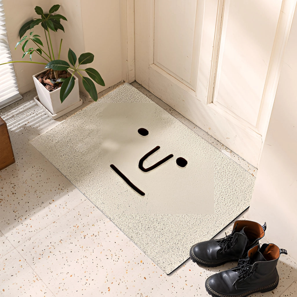 Cartoon design indoor outdoor rug with happy big eyes pattern placed on hardwood flooring near houseplants and cabinetry.