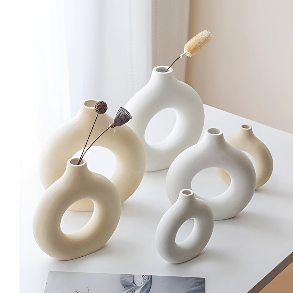 Ceramic donut-shaped vase for modern home decor in white porcelain with a circular design.