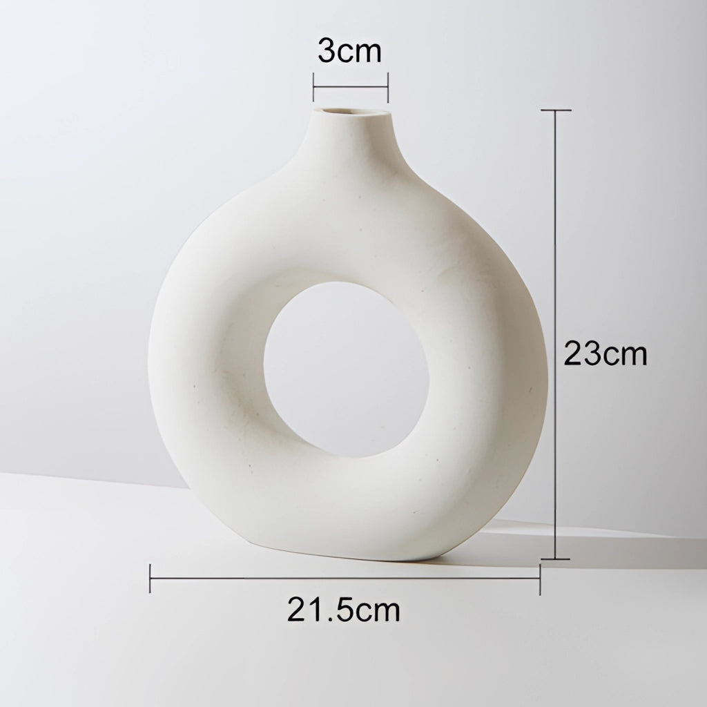 White donut-shaped ceramic vase for modern home decor, large size.