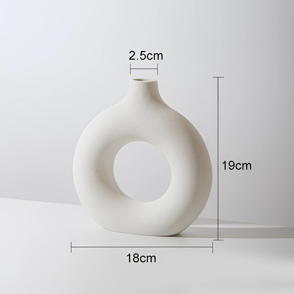 White ceramic donut-shaped vase for modern home decor