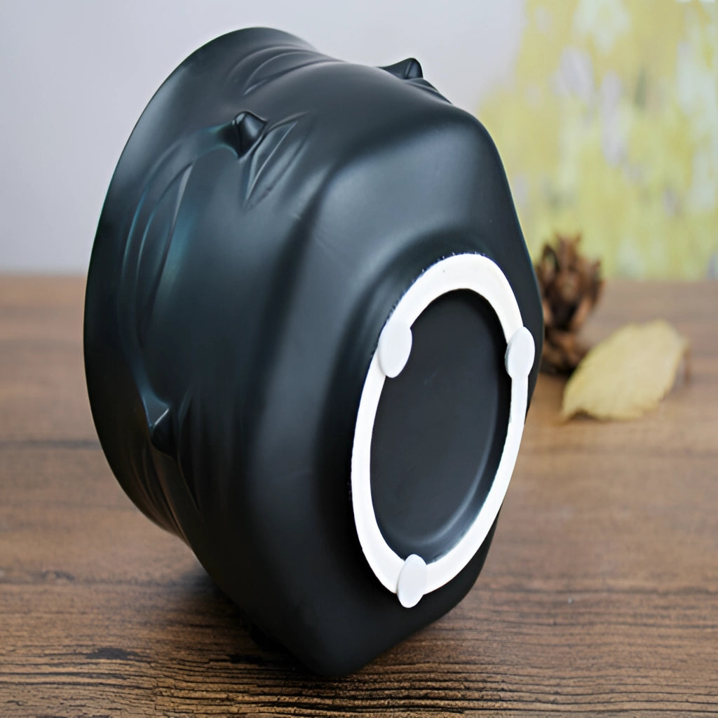 Ceramic face design flowerpot with modern aesthetic, ideal for succulent plants.