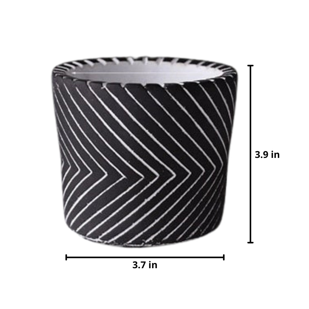 Ceramic hand-painted planter with textured black design, featuring intricate circular and rectangular patterns.