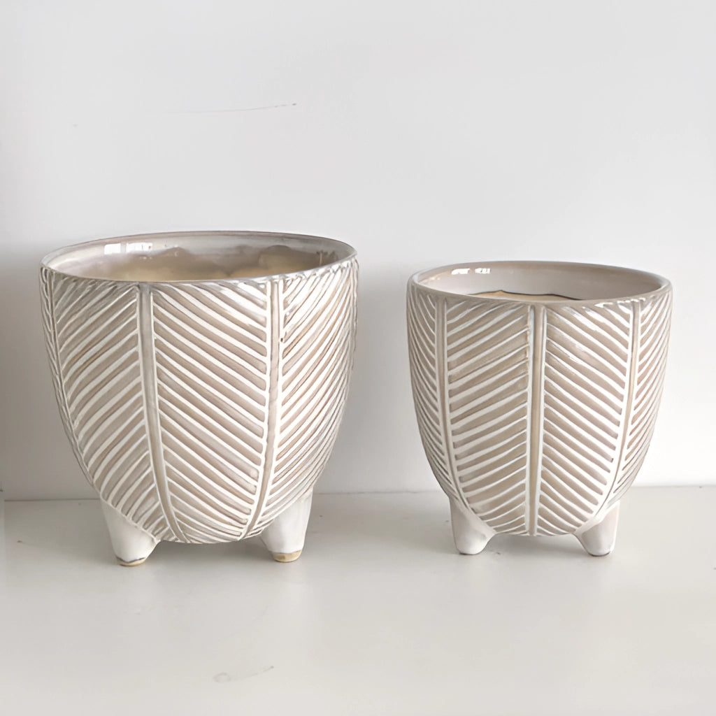 Ceramic Island Holiday Plant Pots with artistic porcelain design, displayed on a table.