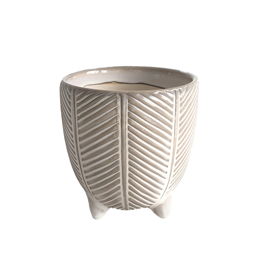 Small Tahiti ceramic island holiday plant pot with a festive design, placed on a wooden surface.