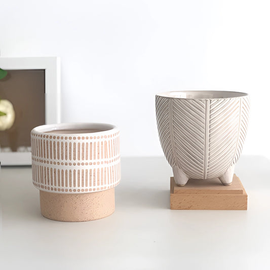 Ceramic Island Holiday Plant Pots displayed on a wooden table.
