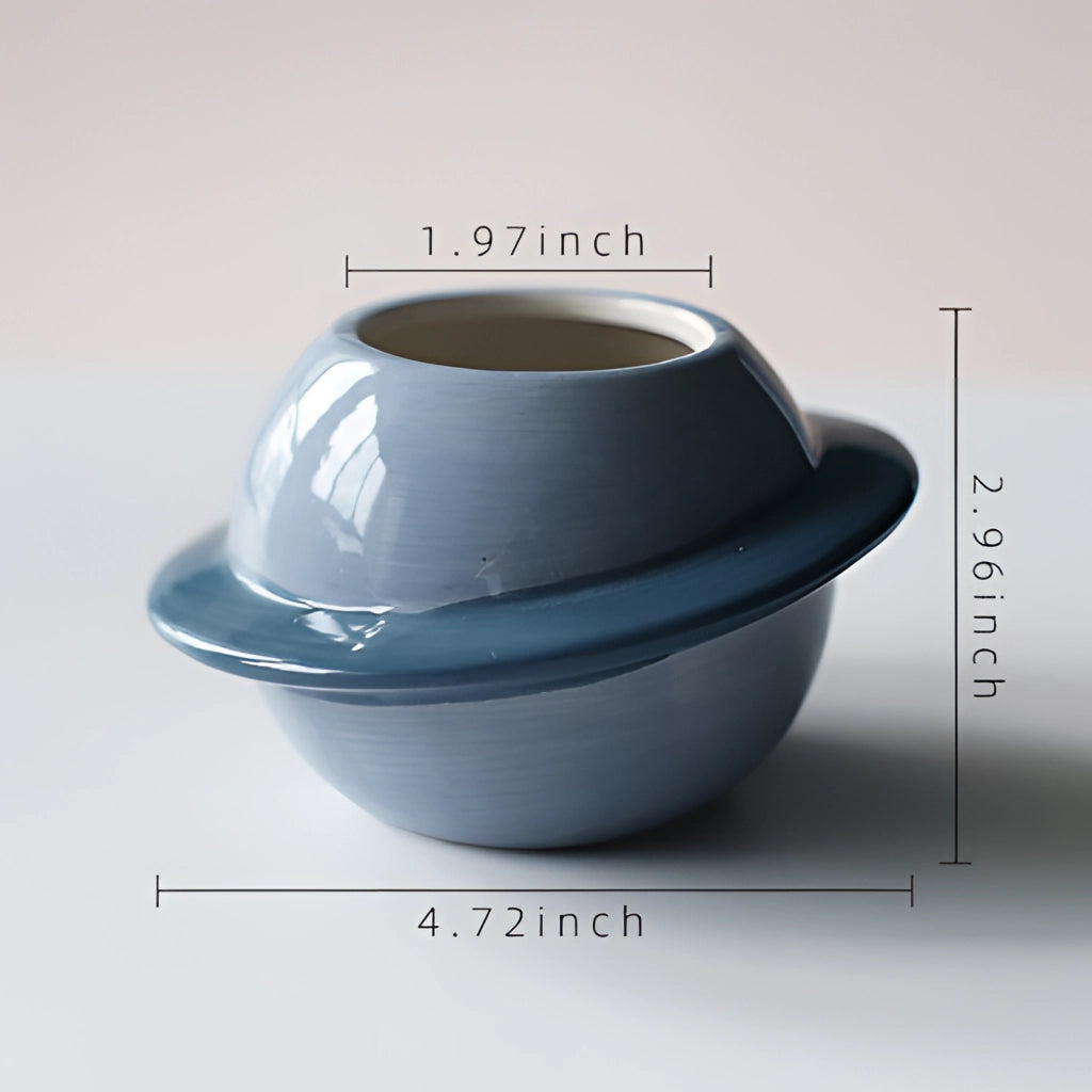 Ceramic Planet Plant Pot with Astral Galaxy Design, showcasing intricate ceramic craftsmanship with a celestial pattern.