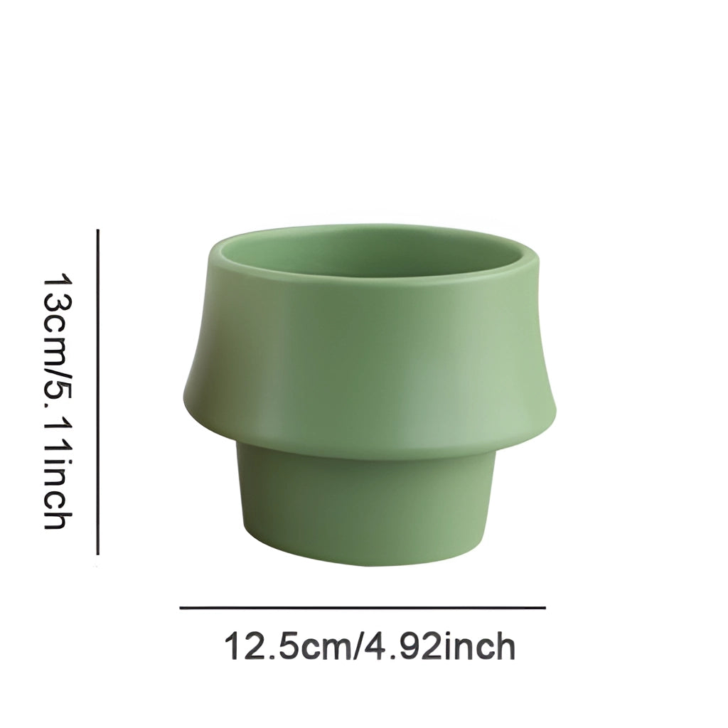 Ceramic planter in rosa with a glazed finish, featuring a Scandinavian style design, cylindrical shape, and smooth texture.