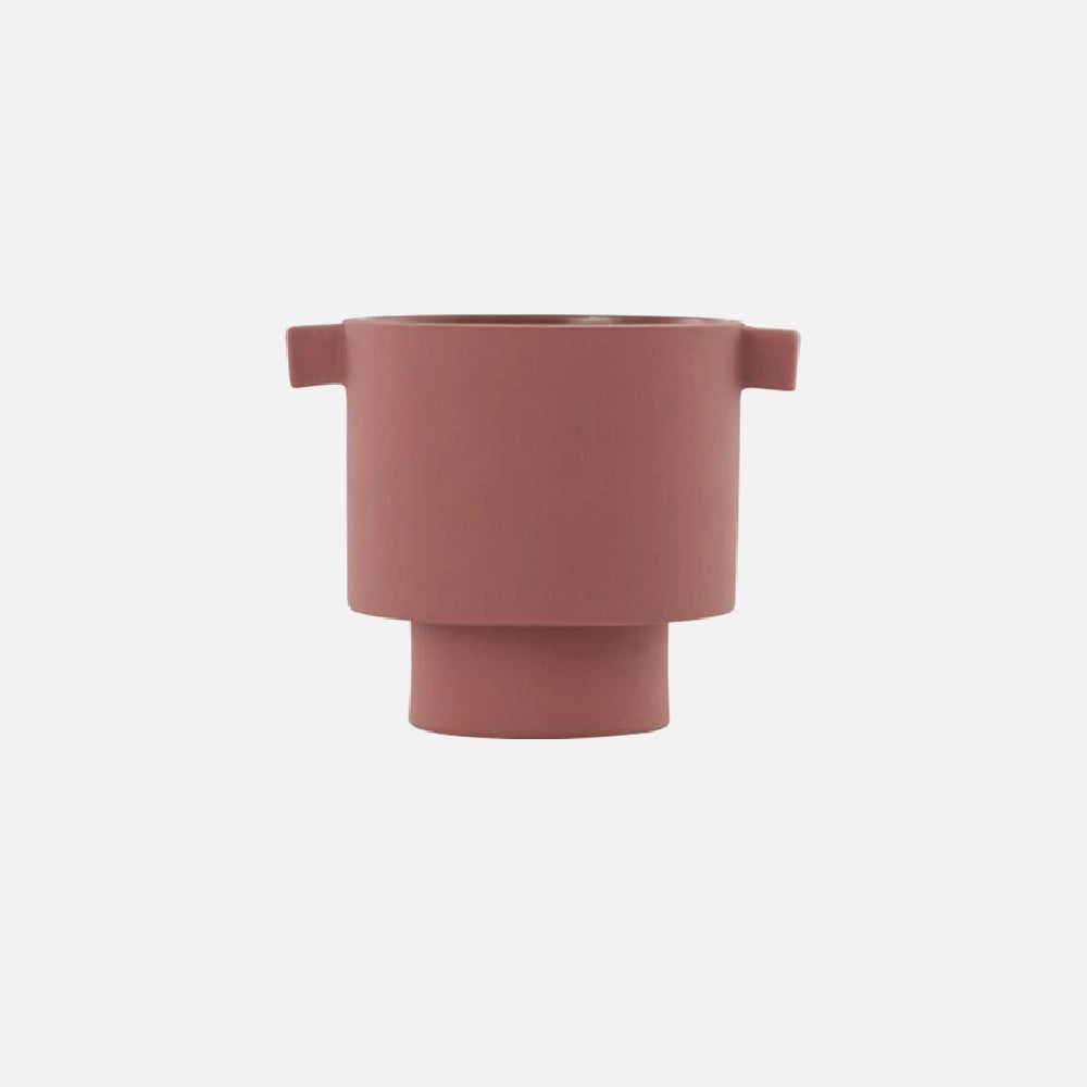 Small hand-molded ceramic vase in earthy cinnamon tones, Scandinavian design.