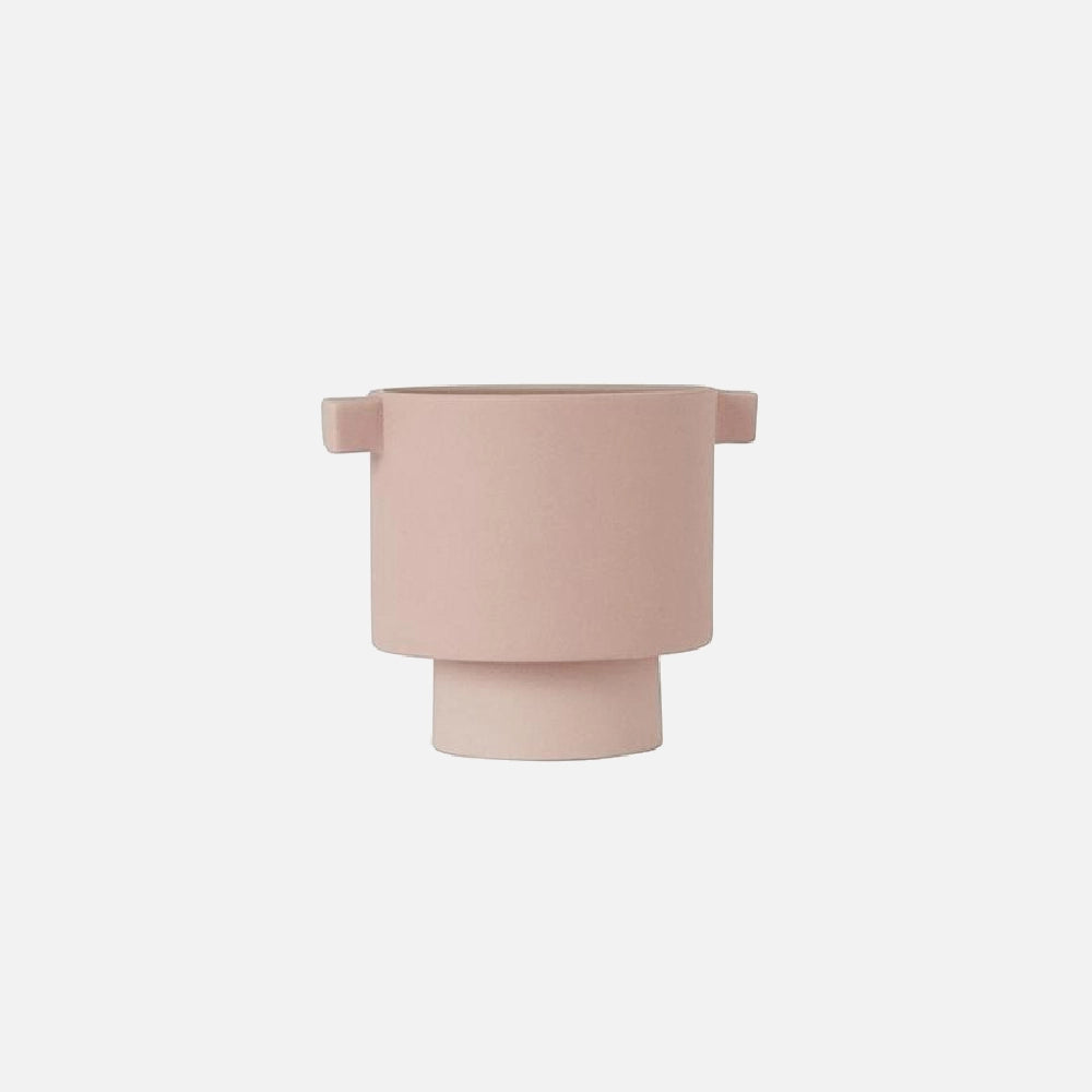 A small rosewater-colored ceramic vase with an earthy tone, featuring a Scandinavian design and hand-molded craftsmanship.