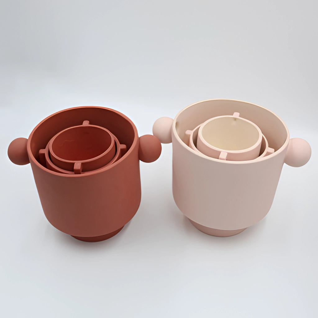 Hand-molded ceramic vase with Scandinavian design in earthy tones, available in small and large sizes, displayed on a tabletop.