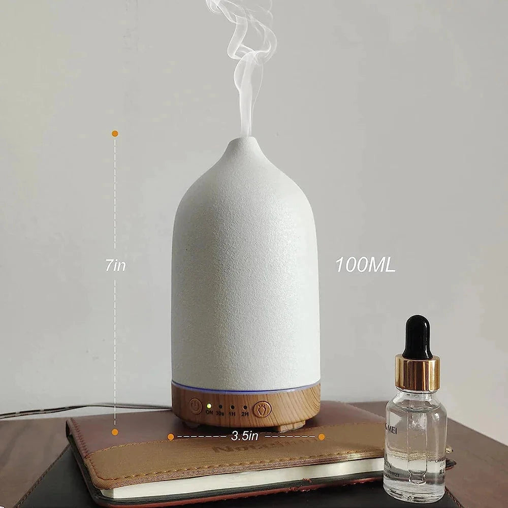 Ceramic Wood Grain Aromatherapy Diffuser with 7-Color Night Light featuring a sleek design, resembling a natural wood texture, and a glass bottle for essential oils, used for personal care and relaxation.