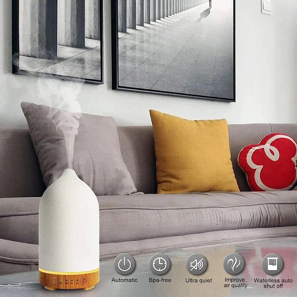 Ceramic Wood Grain Aromatherapy Diffuser with 7-Color Night Light placed on a white couch in a living room setting.