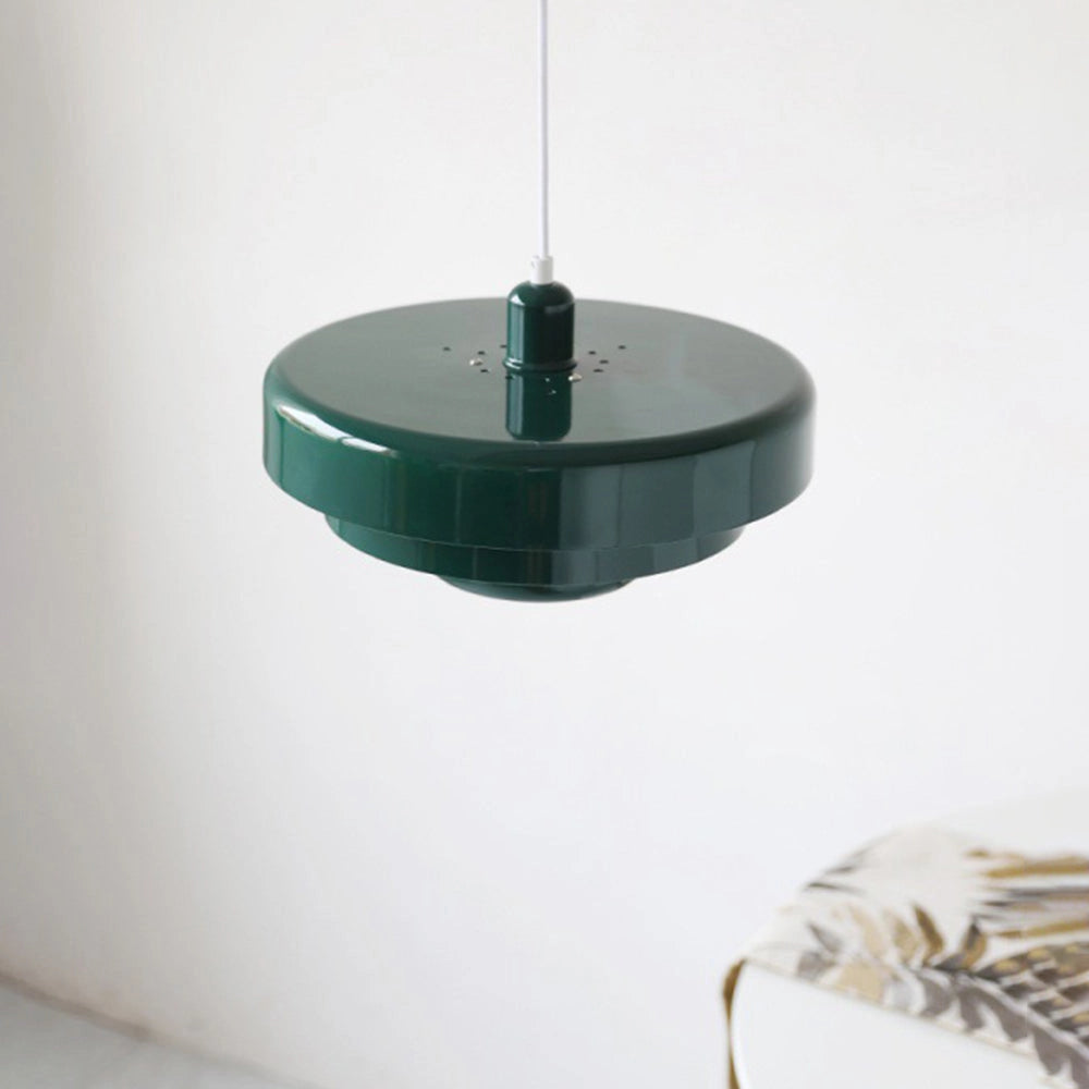 Modern metal pendant lamp with linked circular design, hanging from ceiling, featuring an electric blue light fixture.