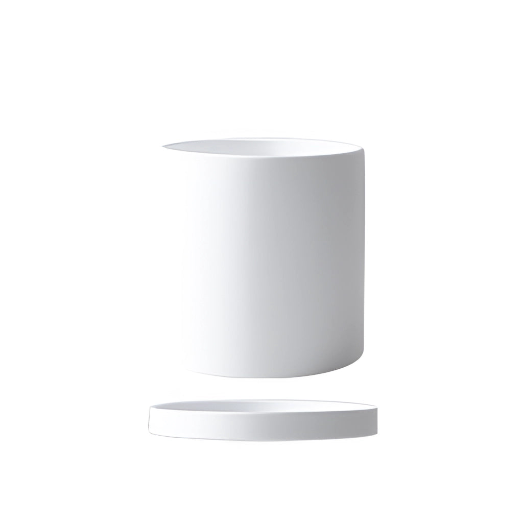 White large cylindrical ceramic planter and saucer set on display.