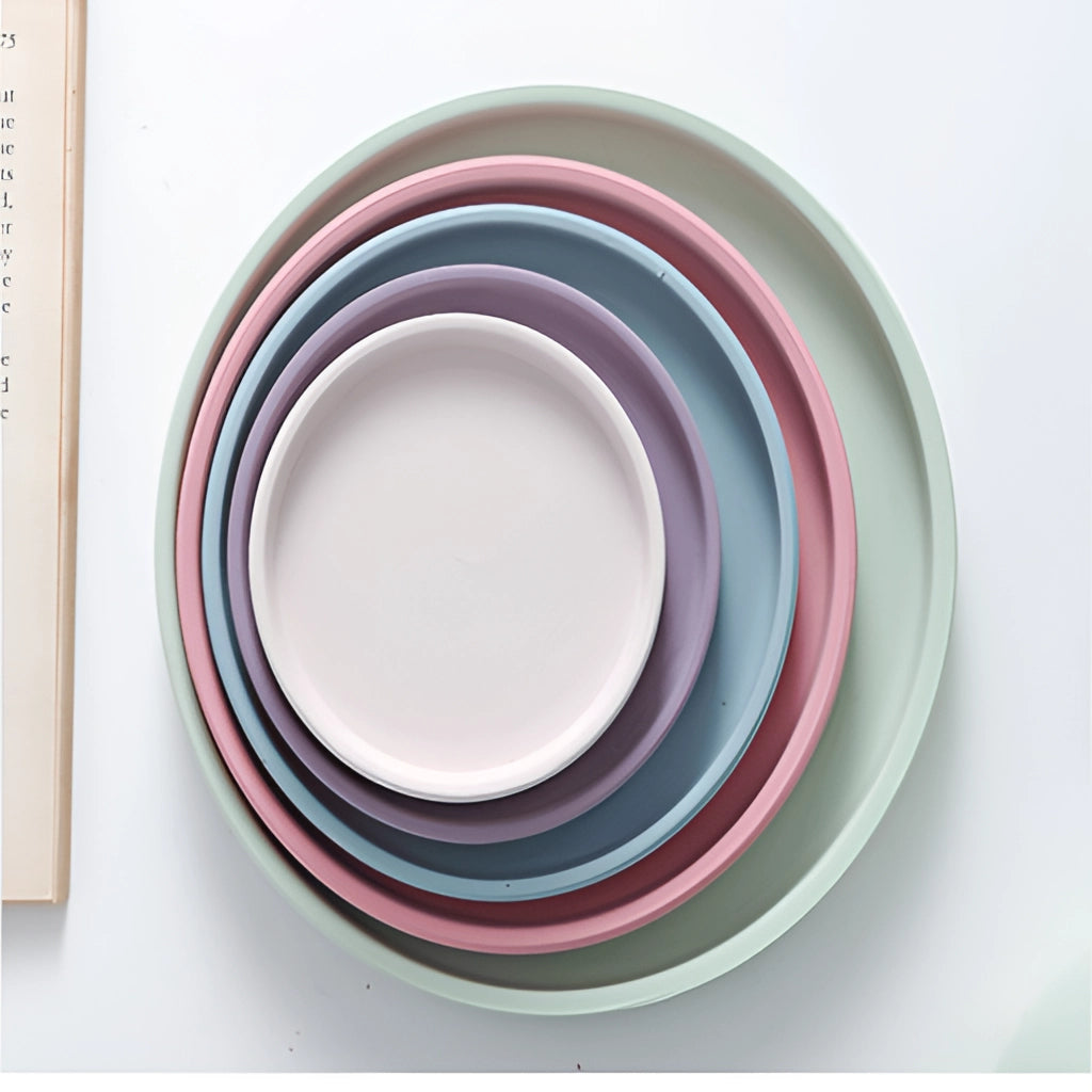 Colorful ceramic planter and saucer set with vibrant patterns and glossy finish.