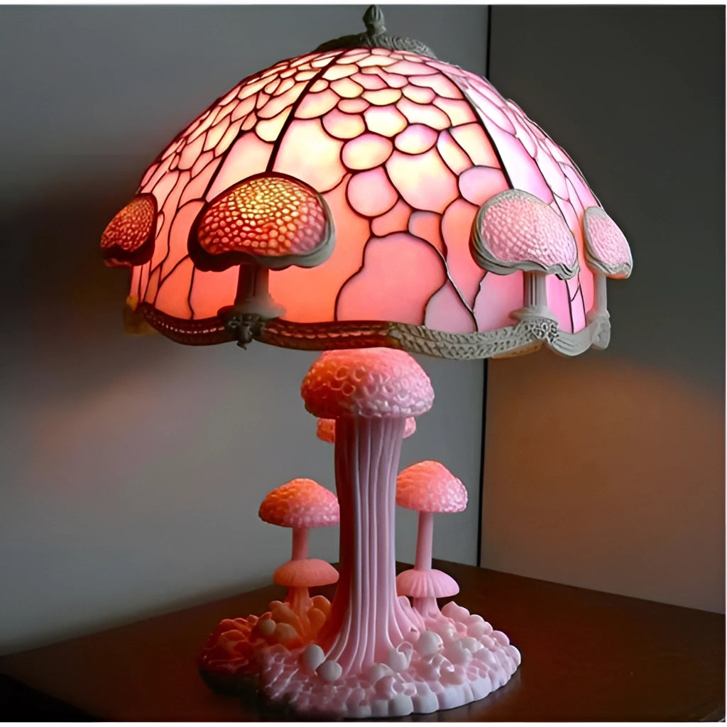 Colorful stained glass mushroom desk light with wooden base and intricate lamp shade design, illuminating softly.
