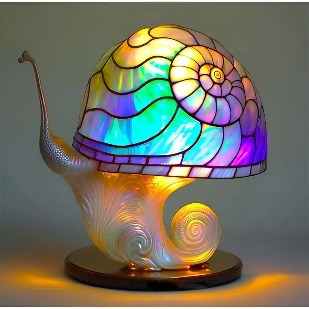 Colorful stained glass mushroom-shaped desk light with vibrant tints and shades, illuminating in electric blue, suitable for decorative art and ambient lighting.