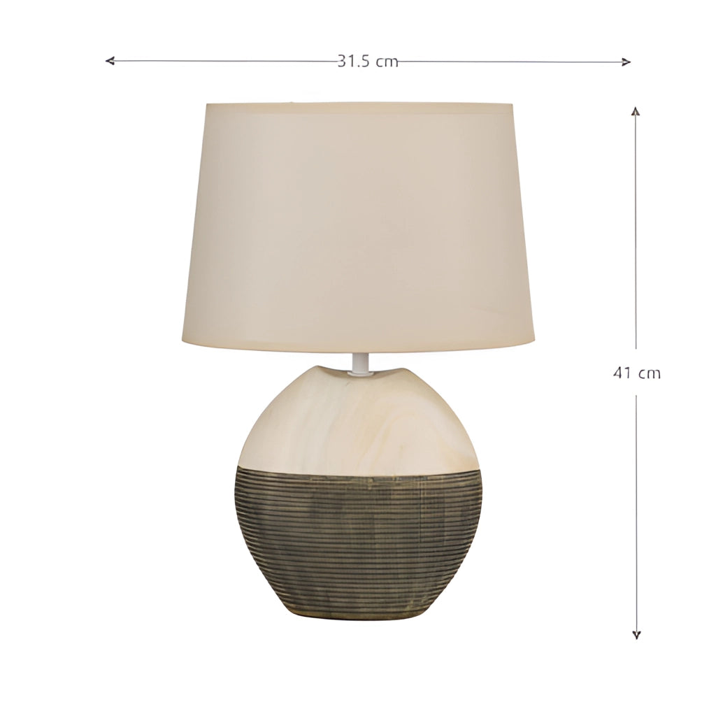 Contemporary table lamp with a beige rectangular lampshade and wooden base, placed on a table in a living room or bedroom.