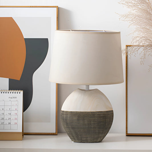 Contemporary lampshade table lamp with a wooden base, rectangular design, and artistic elements, suitable for living room and bedroom.