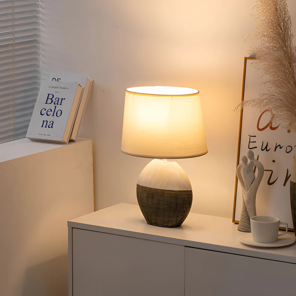 A stylish contemporary table lamp with a sleek wooden base and a modern lampshade, perfect for living rooms and bedrooms.