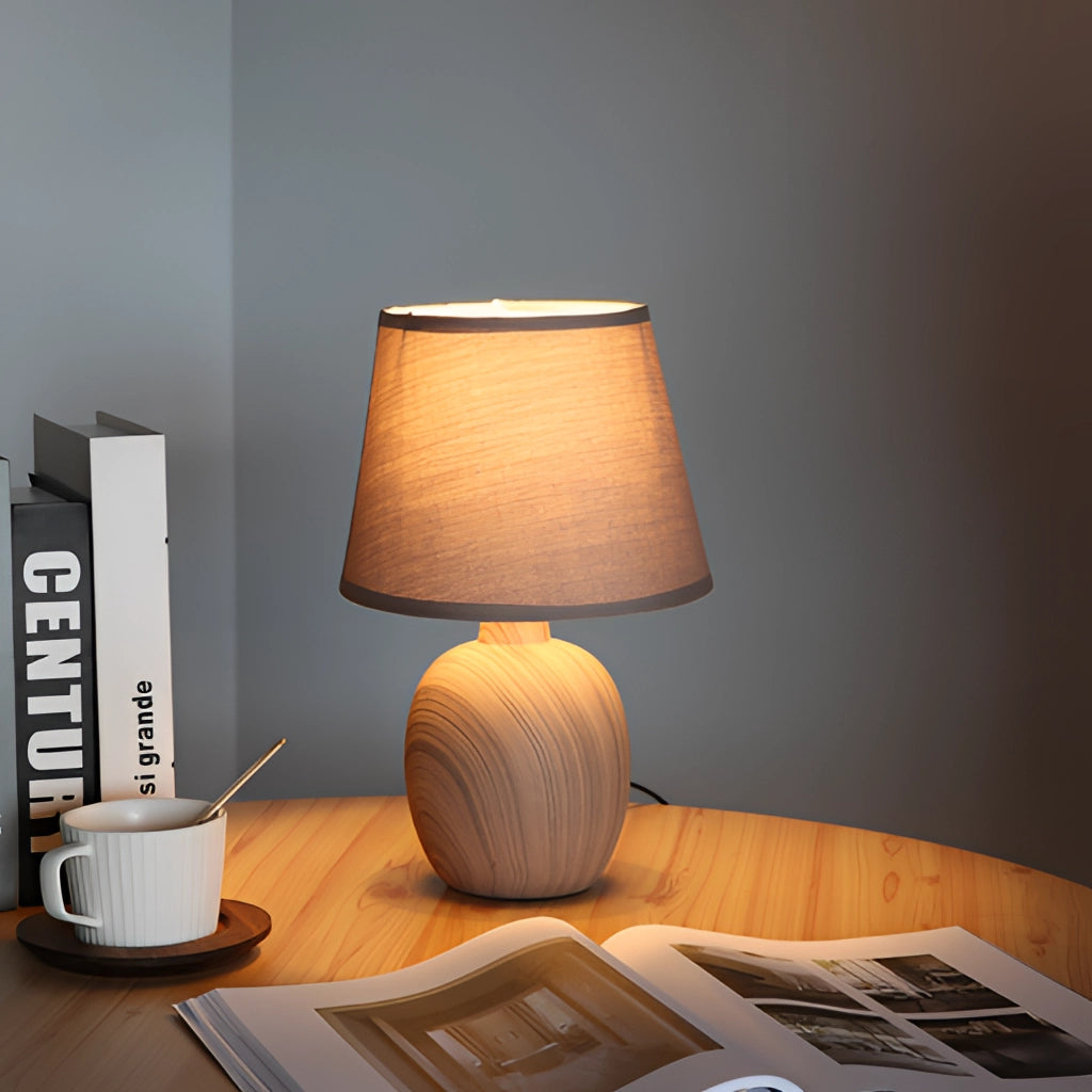 Contemporary rechargeable table lamp with a unique style, featuring a wooden base, a sleek lampshade, and modern lighting.