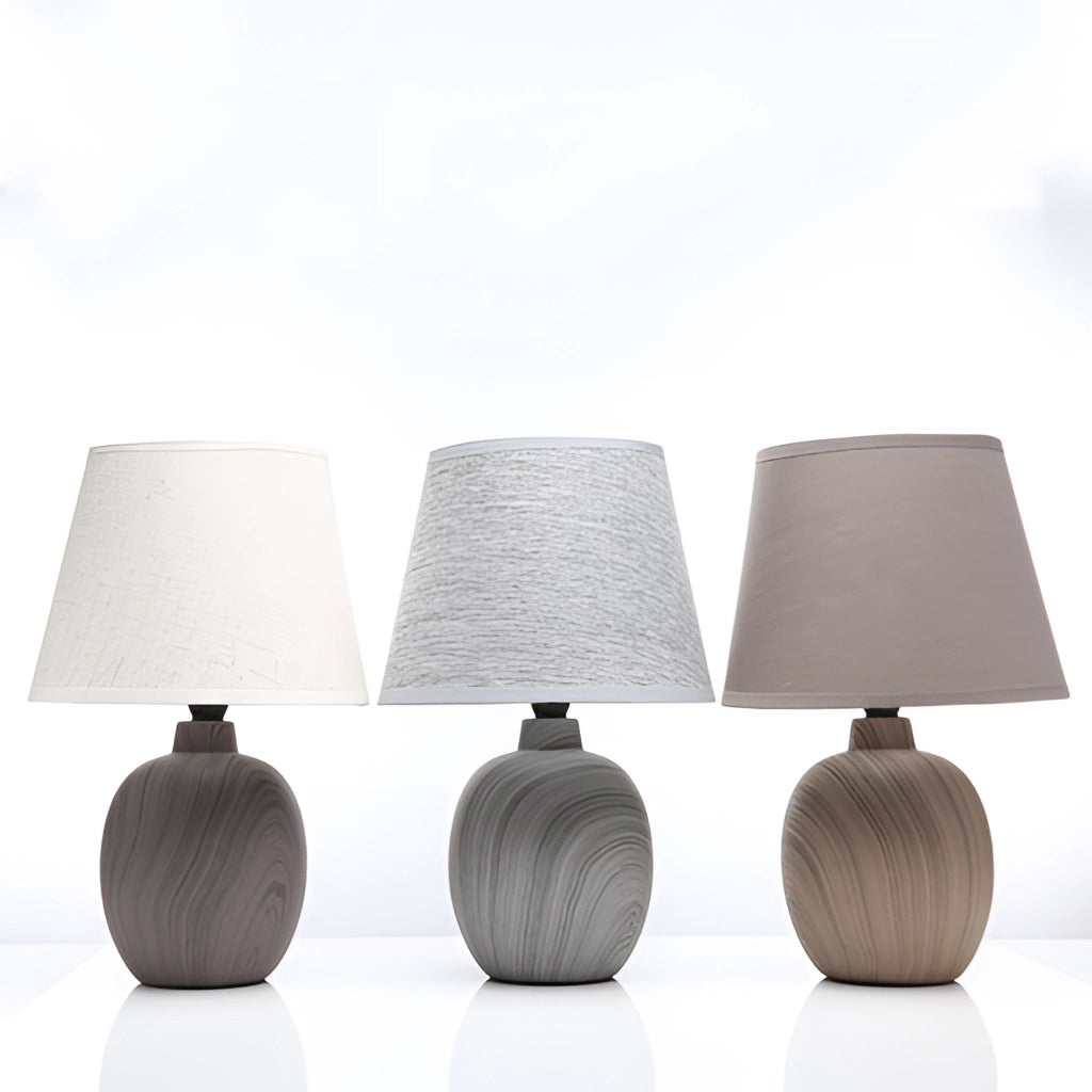 Contemporary rechargeable table lamp with unique style, featuring a sleek grey design, wooden base, and modern artistic elements.