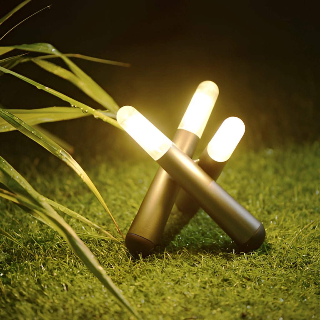 Cordless Kinetic Rotation LED Table Lamp on a wooden surface in an outdoor grassy meadow.