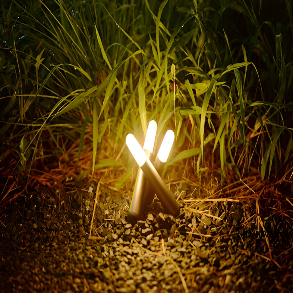 Cordless Kinetic Rotation LED Table Lamp placed on a wooden table beside a green plant with sunlight filtering through branches in the background.