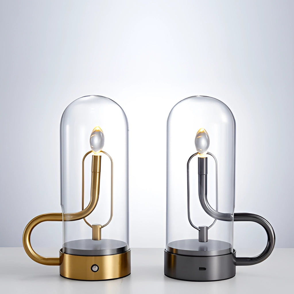 Cordless LED table lamp with a sleek cylindrical design featuring a mix of metal and glass materials, displayed on a rectangular base.