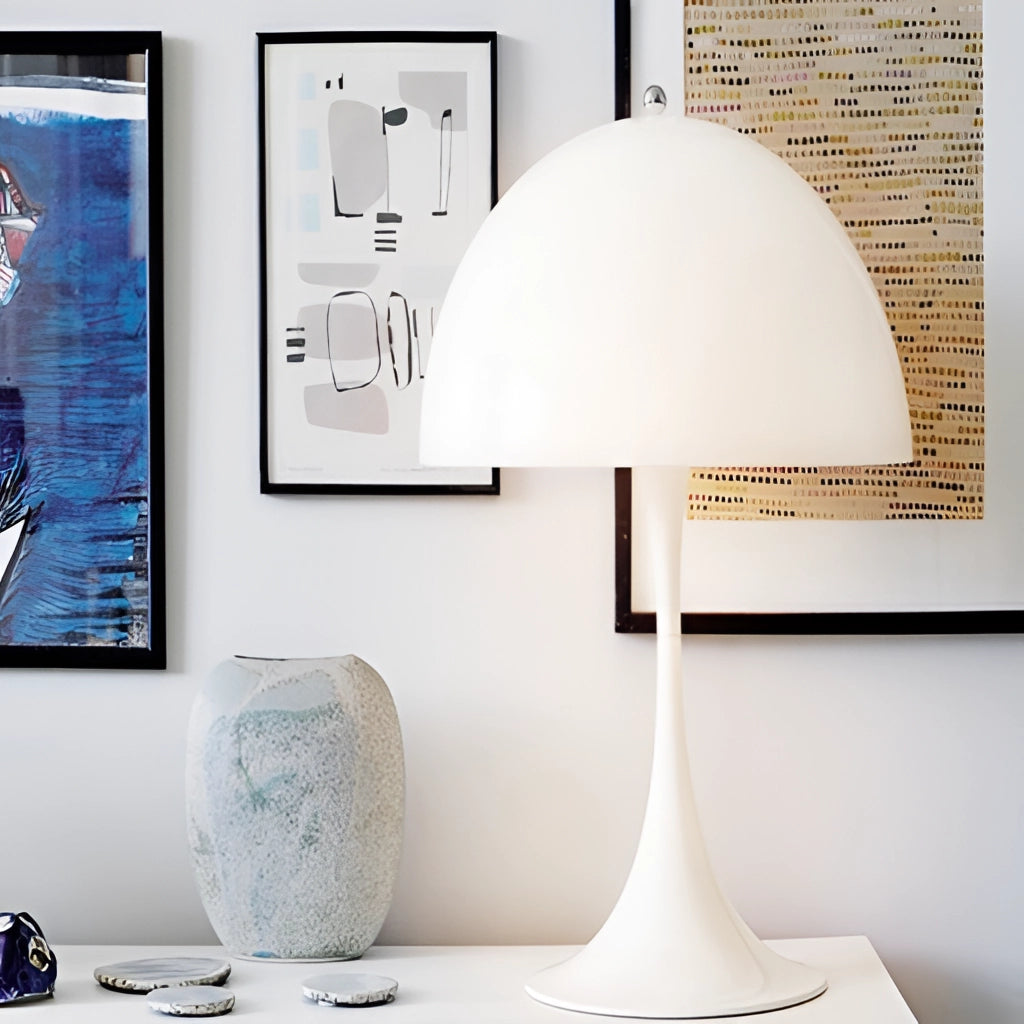 Cordless LED table lamp with rechargeable battery, long battery life, displayed on a white table with dishware and drinkware, highlighting its sleek design and bright light for interior decor.