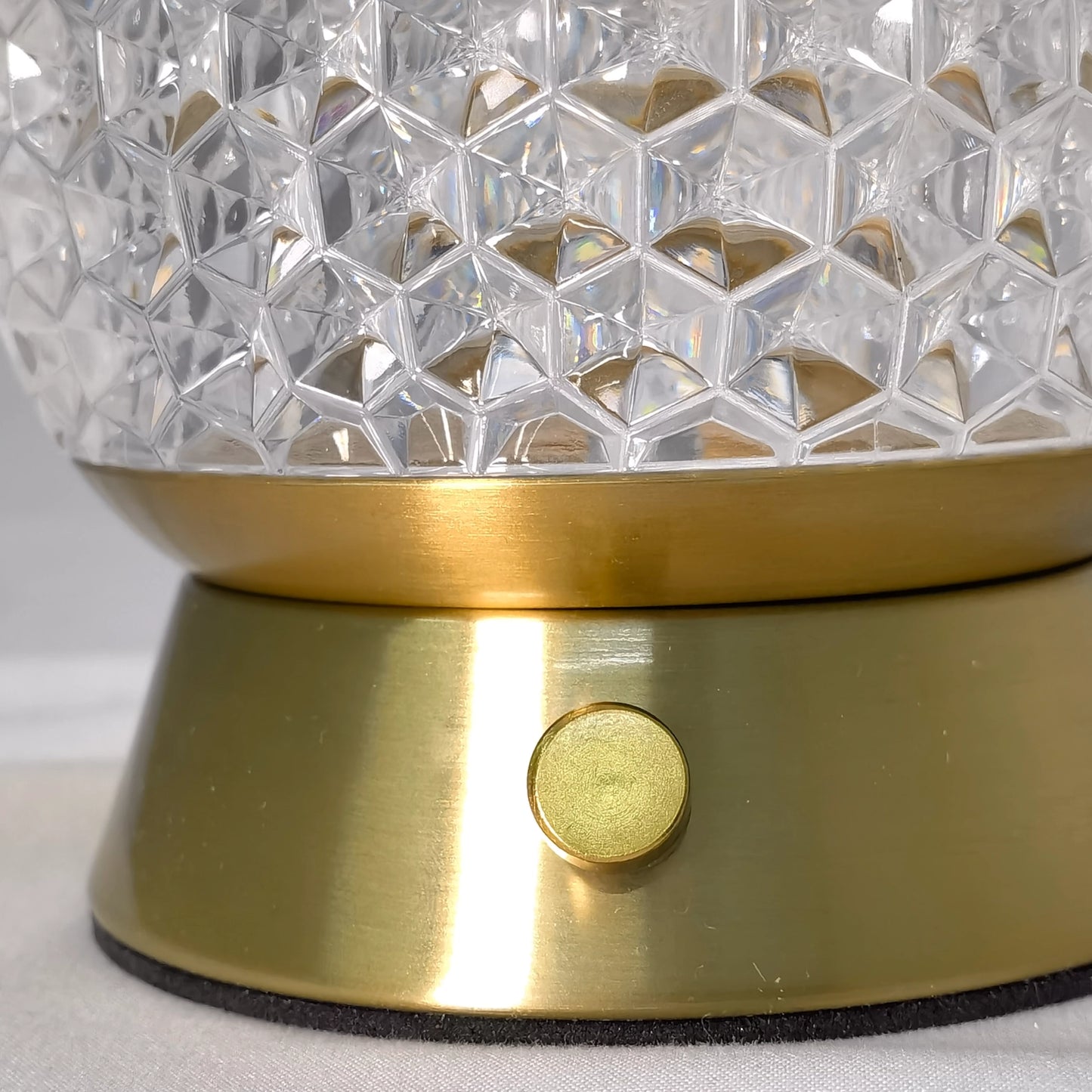 Modern cordless rechargeable LED table lamp with a dimmable light, featuring a sleek silver metal and glass design.