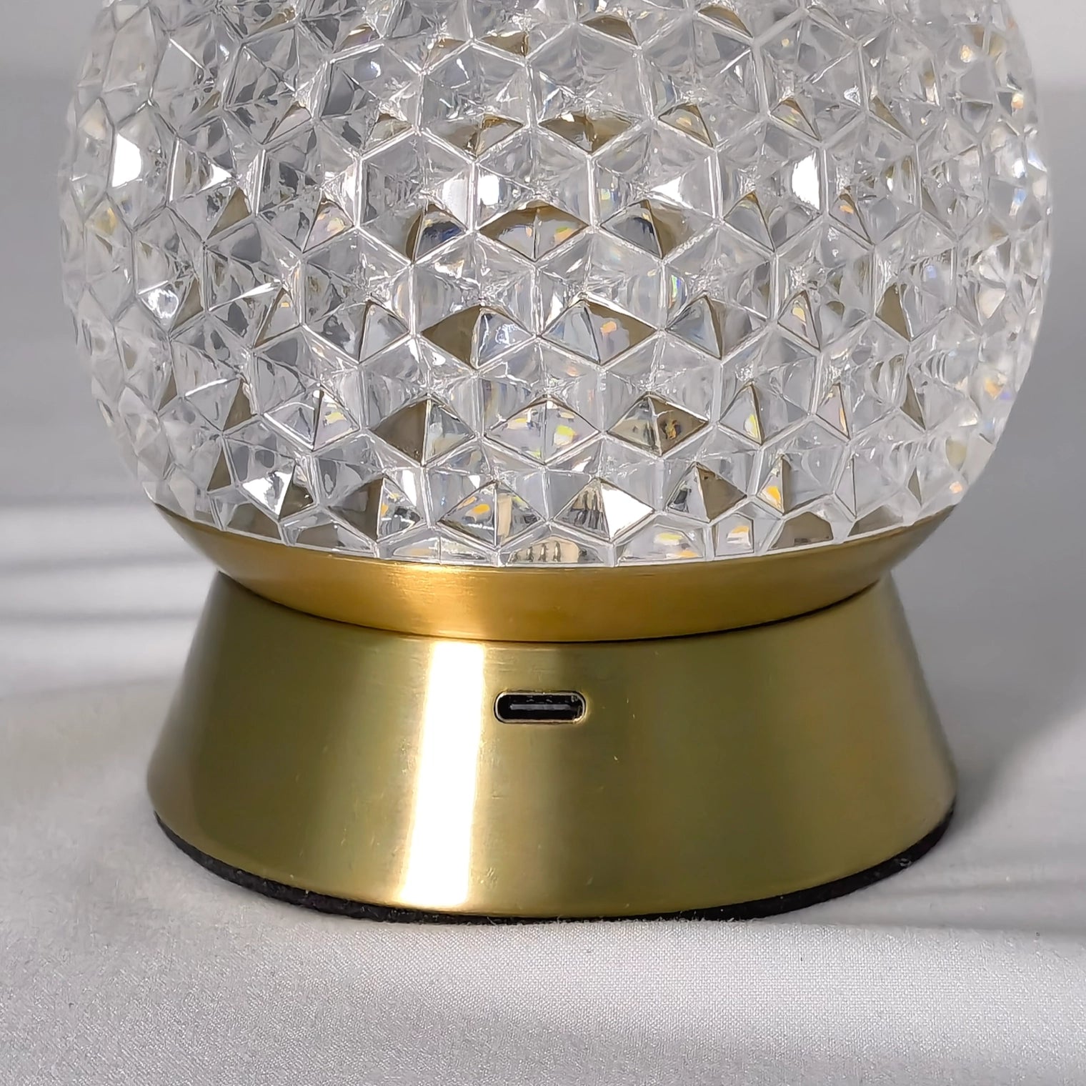 Modern cordless rechargeable table lamp with a dimmable LED light, featuring a sleek nickel finish and circular metal design.