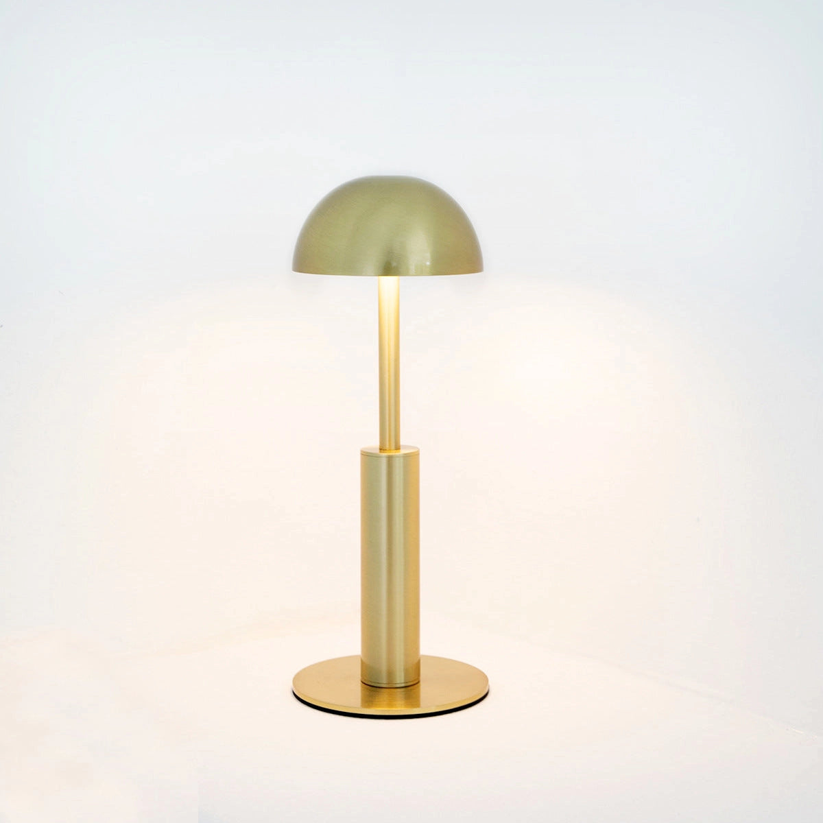 Cordless rechargeable table lamp with unique sculptural design featuring a wooden base, glass elements, and artistic lampshade.