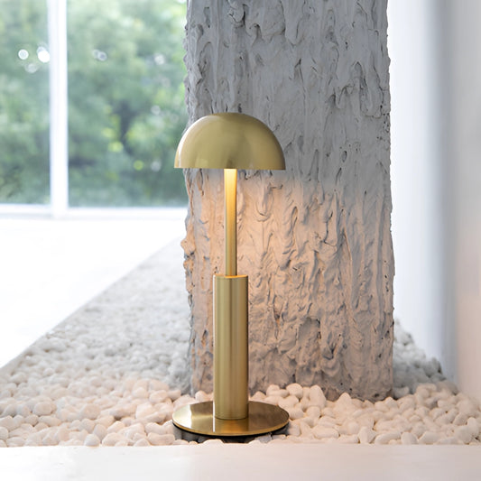 Cordless rechargeable table lamp with unique sculptural design featuring a wooden cylindrical base and modern lighting accessory.