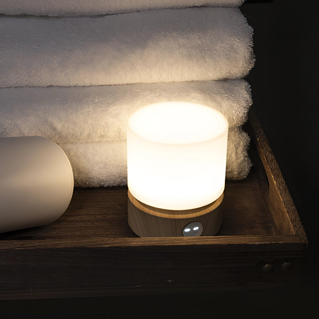 Cordless table lamp with adjustable brightness and long battery life, featuring a sleek wooden base and modern design.